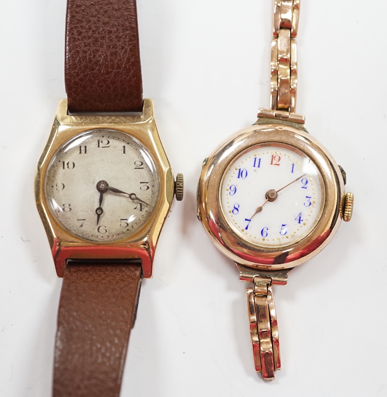 A lady's early 20th century 9k manual wind wrist watch, on an expanding 9ct bracelet(a.f.), together with a lady's 1930's 9ct Tavanne manual wind wrist watch, on a leather strap.